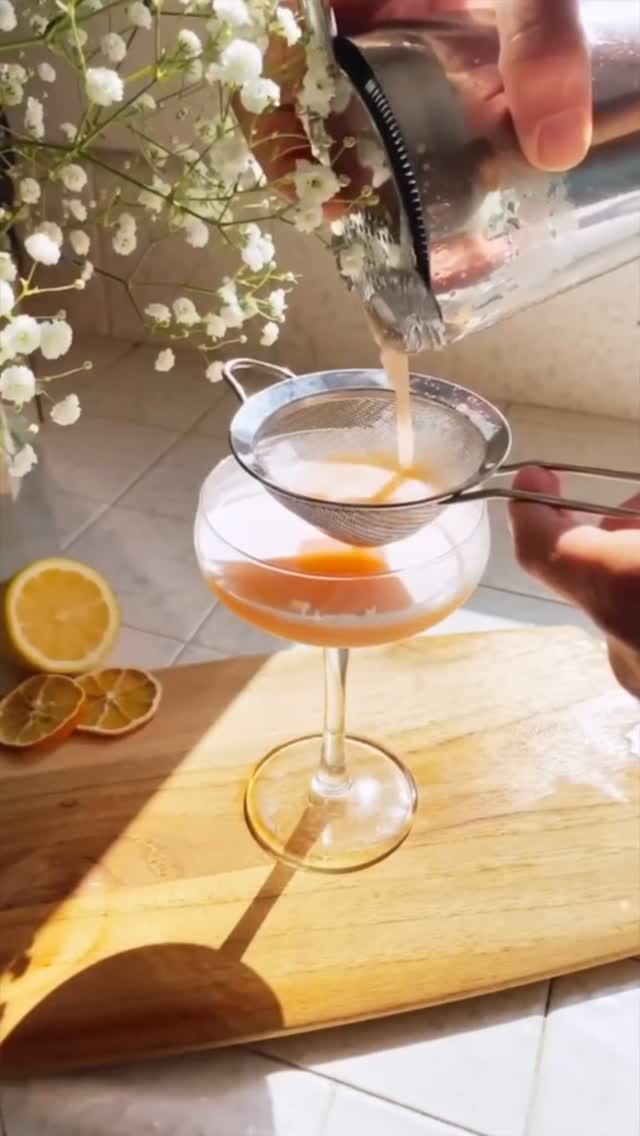A cocktail being poured and strained at Sonder